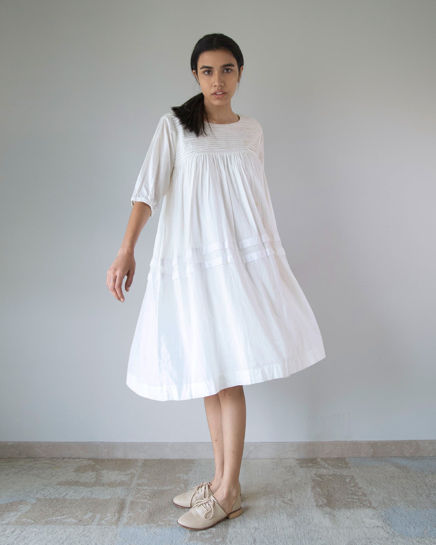 pleated yoke dress Floral pink pleated yoke dress with minute bead details